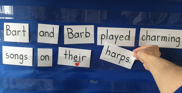 reading r controlled ar sentence strip on pocket chart