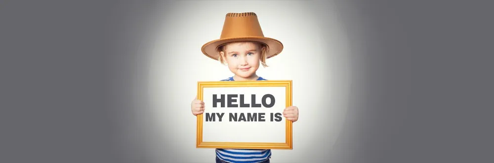 Embedded desk name plate featured image of a little girl holding a hello my name is sign.