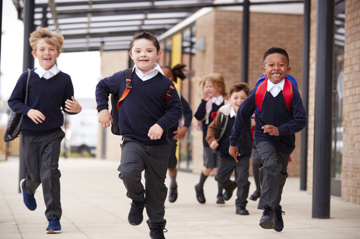 Excited kids running to class.