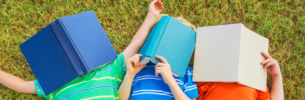 Sentence fluency featured image of 3 kids holding a book over their faces.