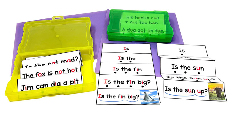 Fluency foldable strips displayed and stored in colored plastic containers.